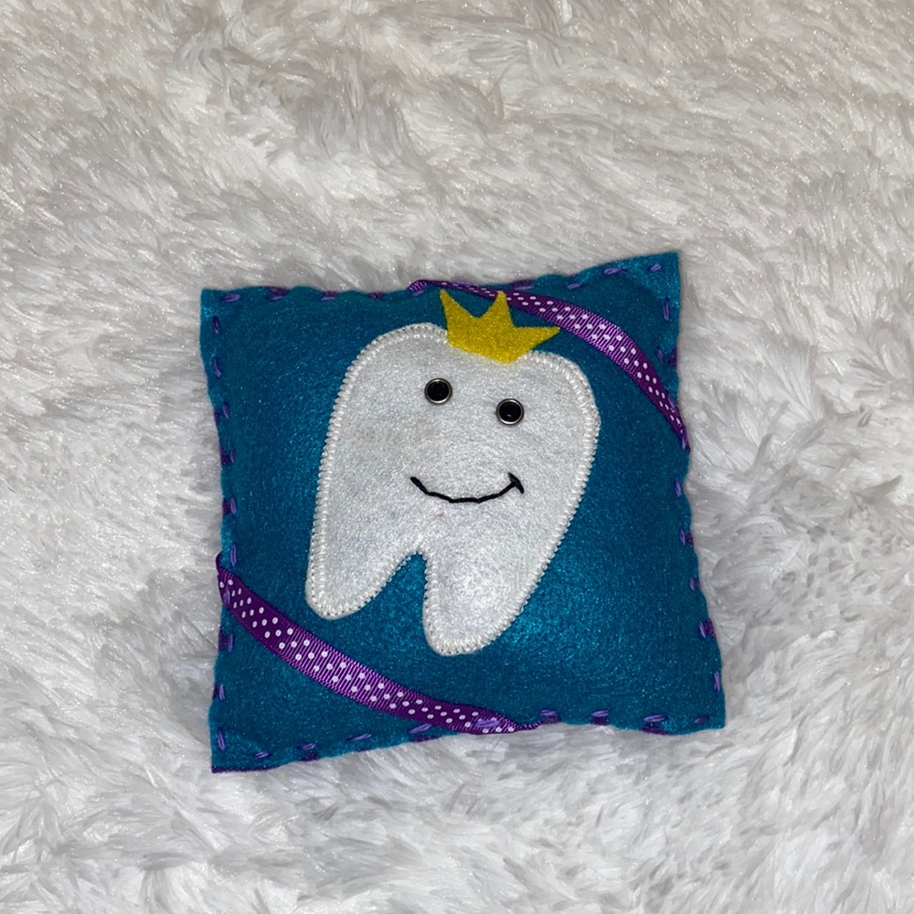 Tooth Fairy Pillow with Tooth wearing crown. Blue/Purple
